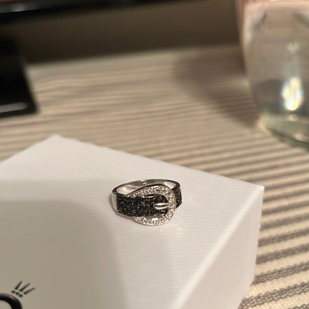 A ring in the design of a belt